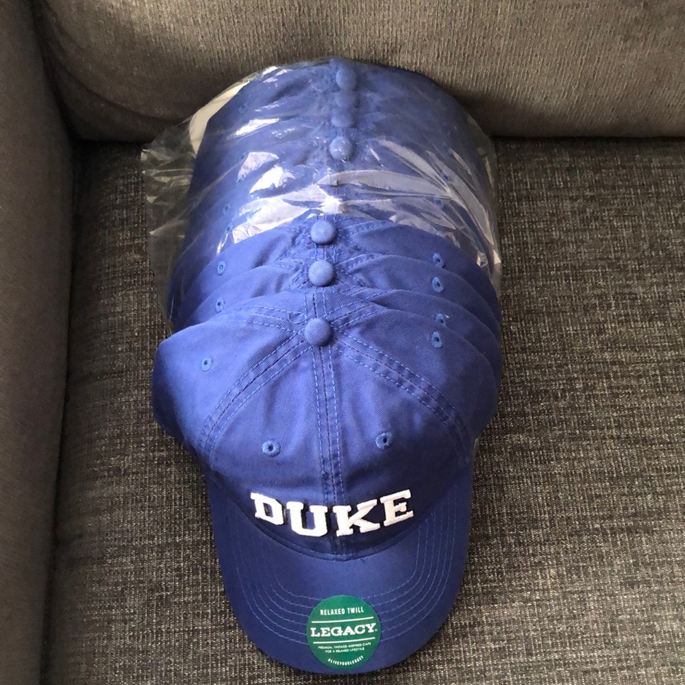 Legacy Duke hats. Solid blue with “Duke”. Pic of back provided. Qty: 11